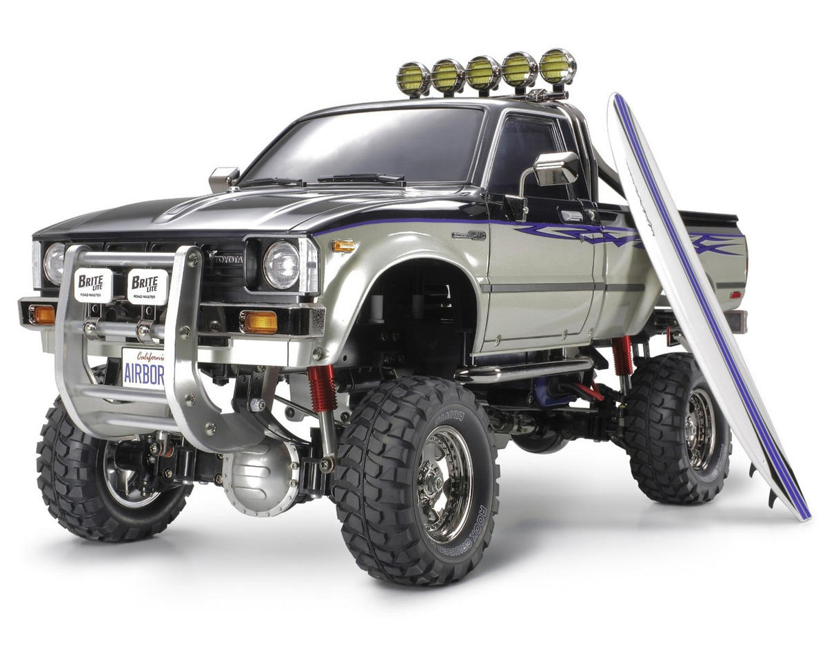 TAMIYA 58397 Toyota Hilux High-Lift Electric 4X4 Scale Truck Kit w/3-Speed & Surfboard